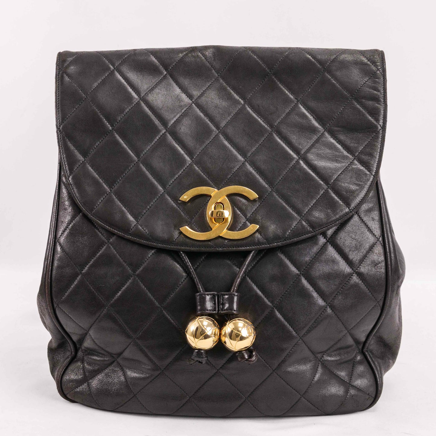 Authentic CHANEL  Lambskin Quilted Tassel Drawstring Backpack Black