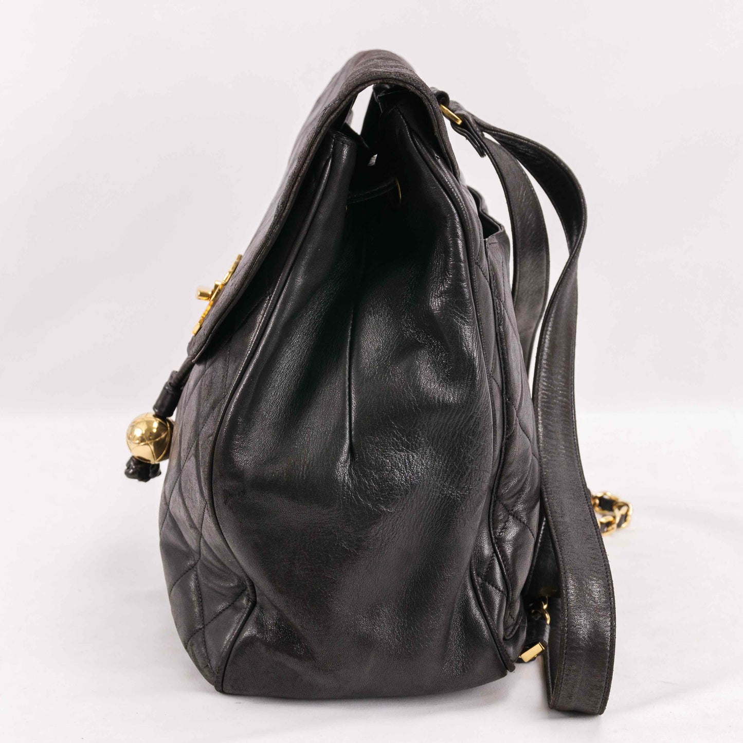 Authentic CHANEL  Lambskin Quilted Tassel Drawstring Backpack Black