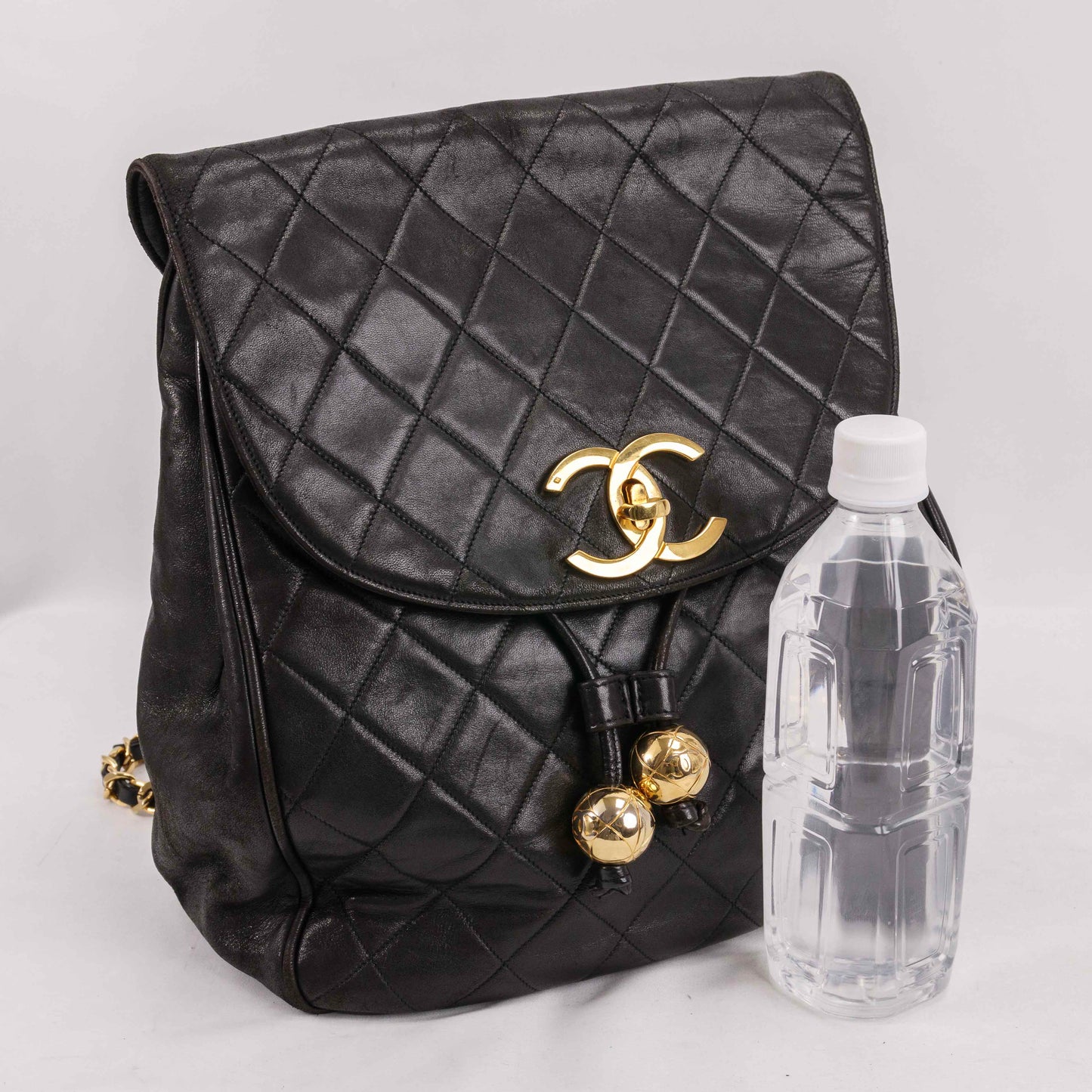 Authentic CHANEL  Lambskin Quilted Tassel Drawstring Backpack Black