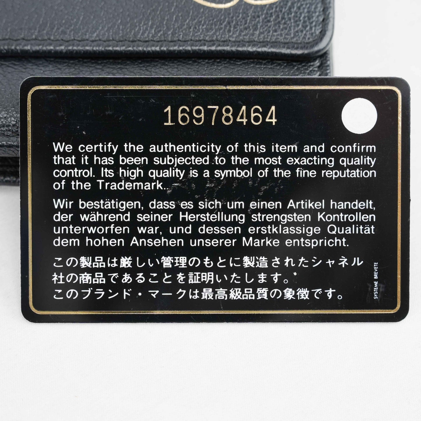 Chanel Camellia Motif Wallet on Chain Black Lambskin Leather Crossbody Bag