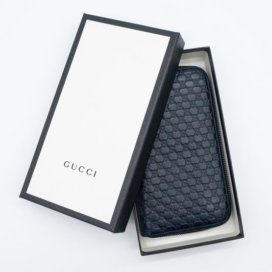 Gucci GG Embossed Navy Blue Zip-Around Wallet