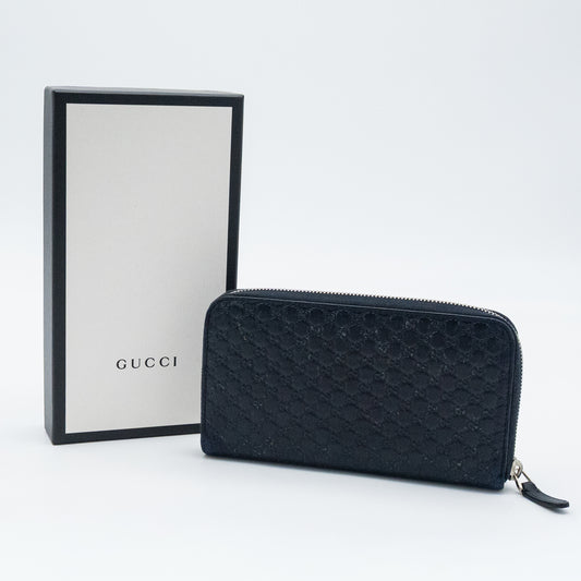 Gucci GG Embossed Navy Blue Zip-Around Wallet