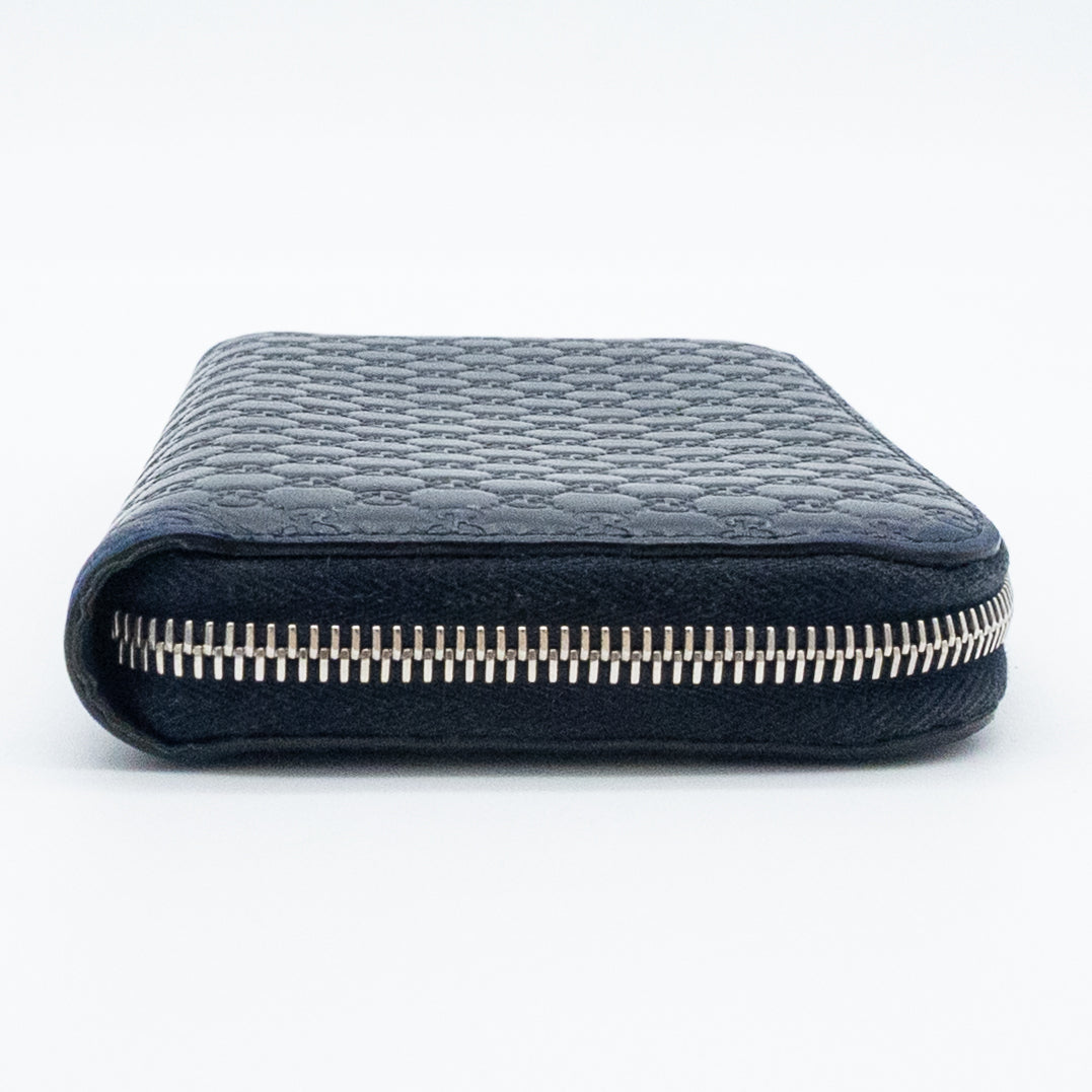 Gucci GG Embossed Navy Blue Zip-Around Wallet