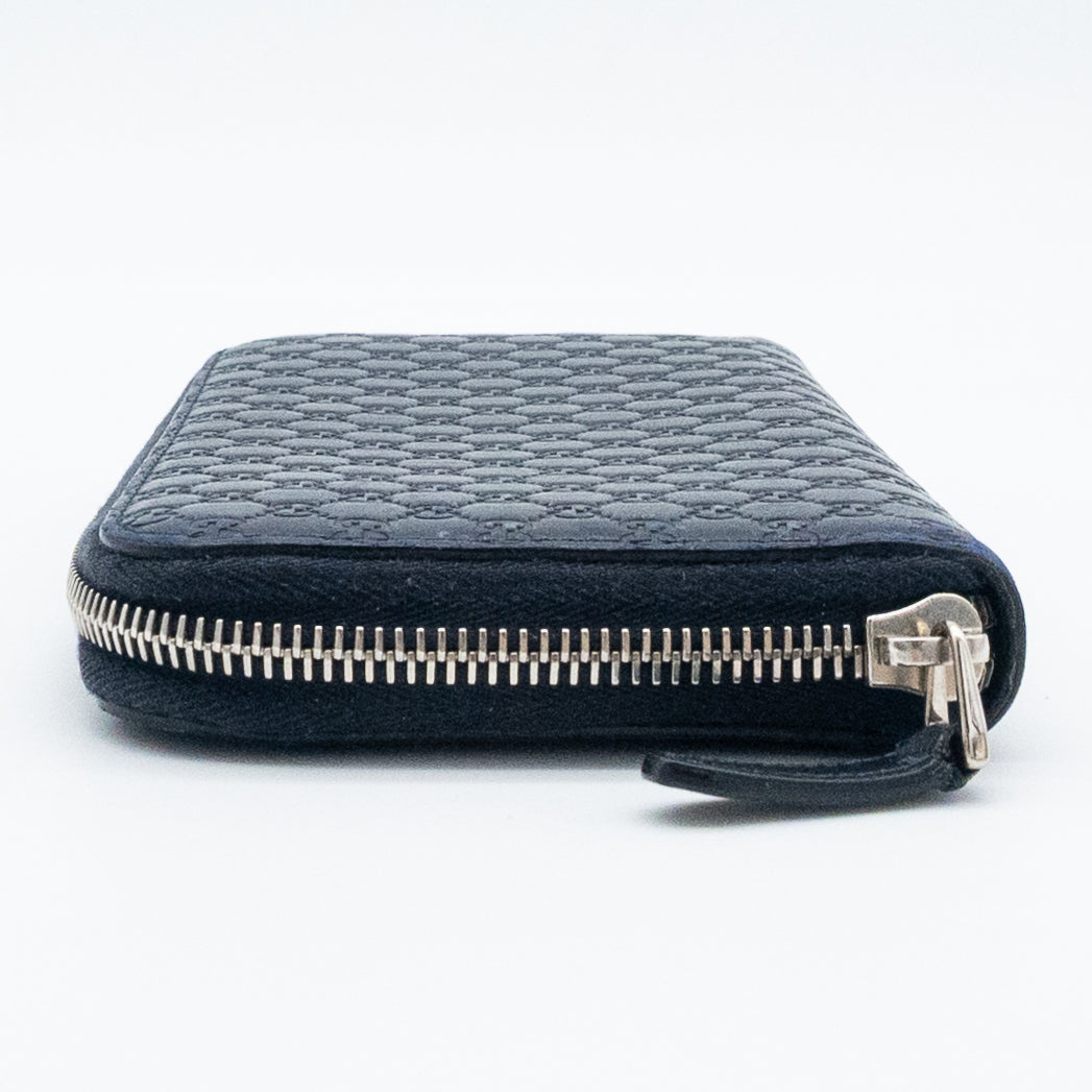Gucci GG Embossed Navy Blue Zip-Around Wallet