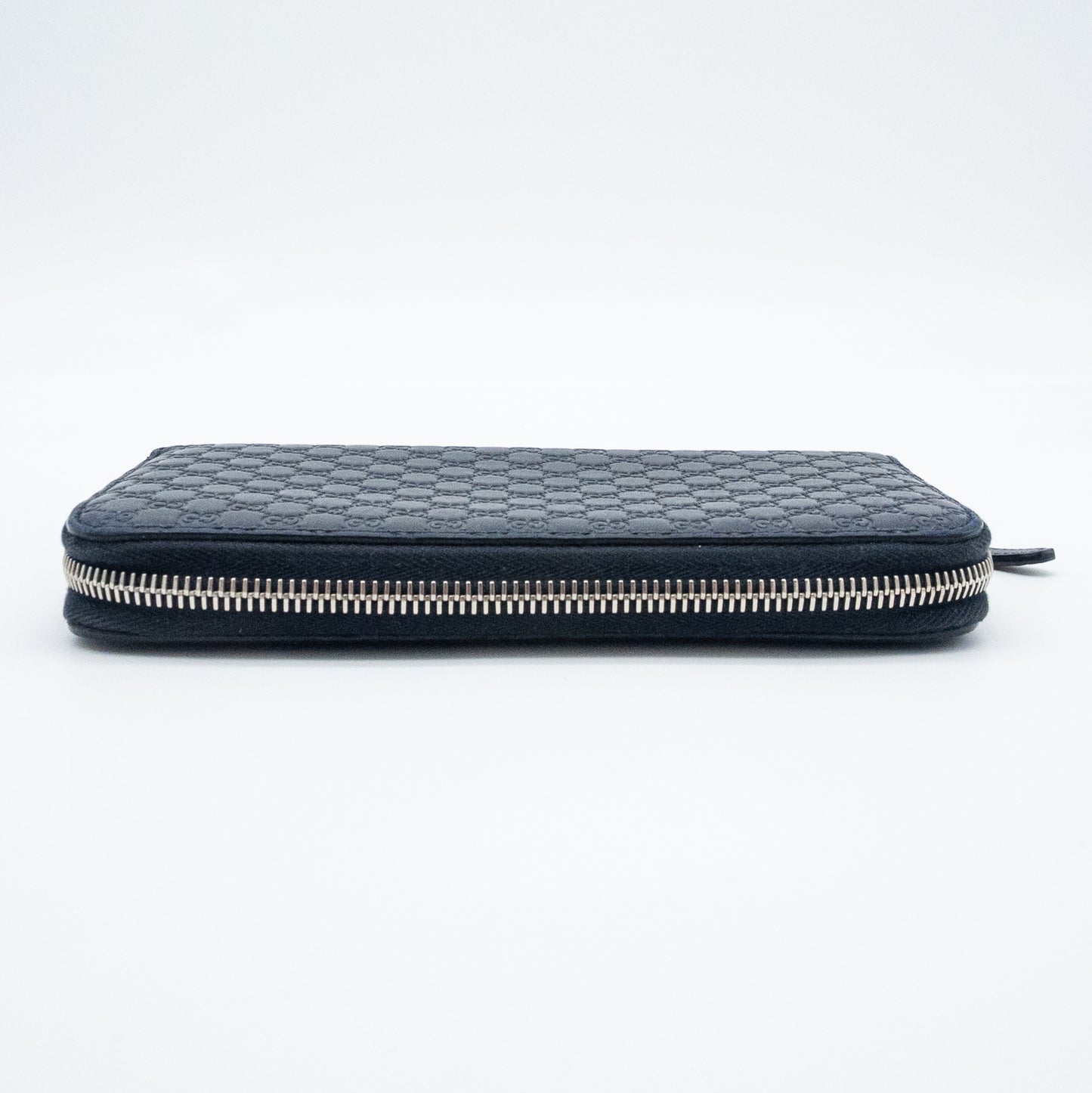 Gucci GG Embossed Navy Blue Zip-Around Wallet