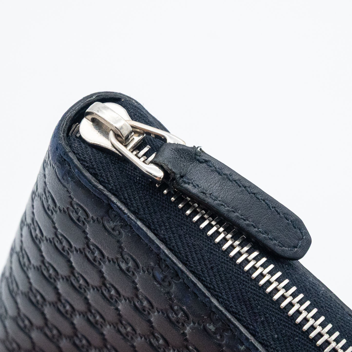 Gucci GG Embossed Navy Blue Zip-Around Wallet
