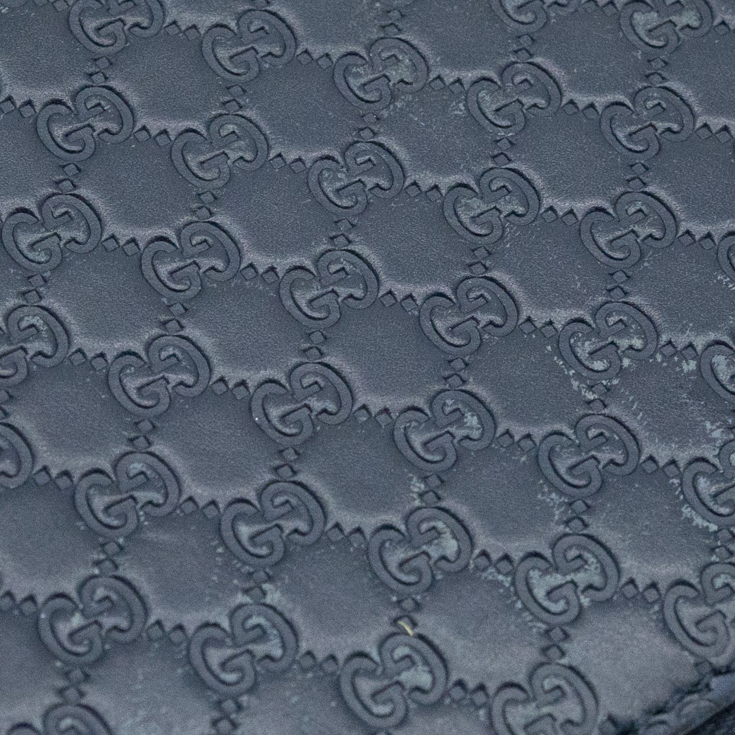 Gucci GG Embossed Navy Blue Zip-Around Wallet