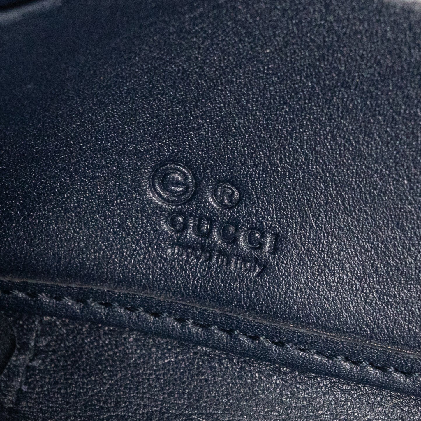 Gucci GG Embossed Navy Blue Zip-Around Wallet