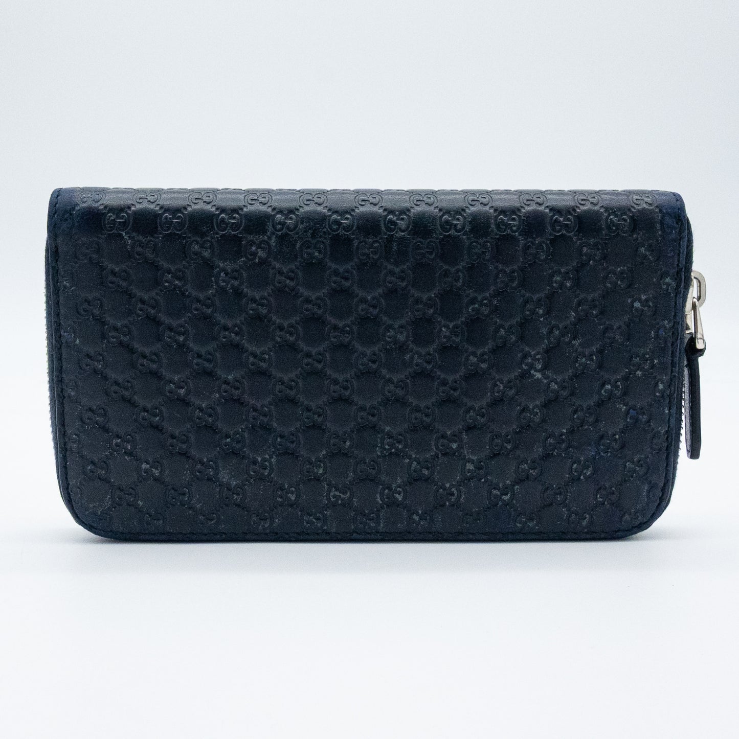 Gucci GG Embossed Navy Blue Zip-Around Wallet