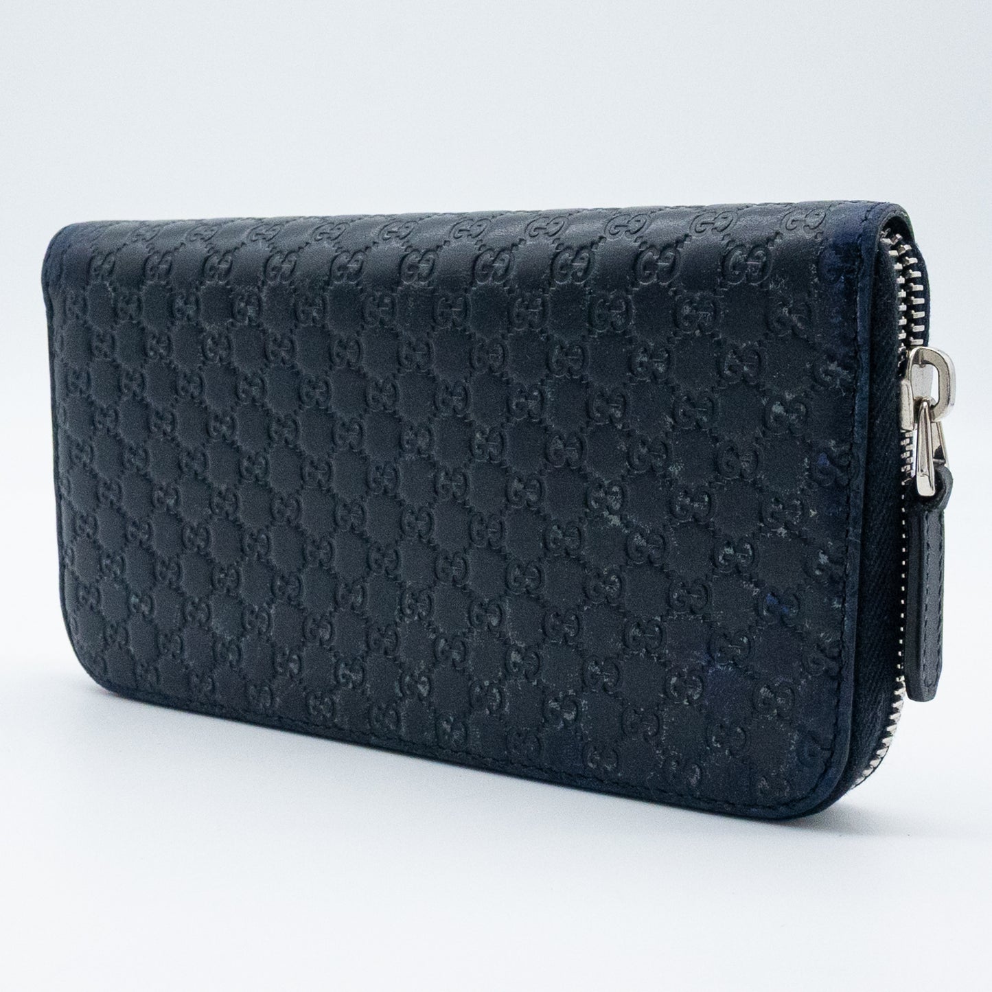 Gucci GG Embossed Navy Blue Zip-Around Wallet