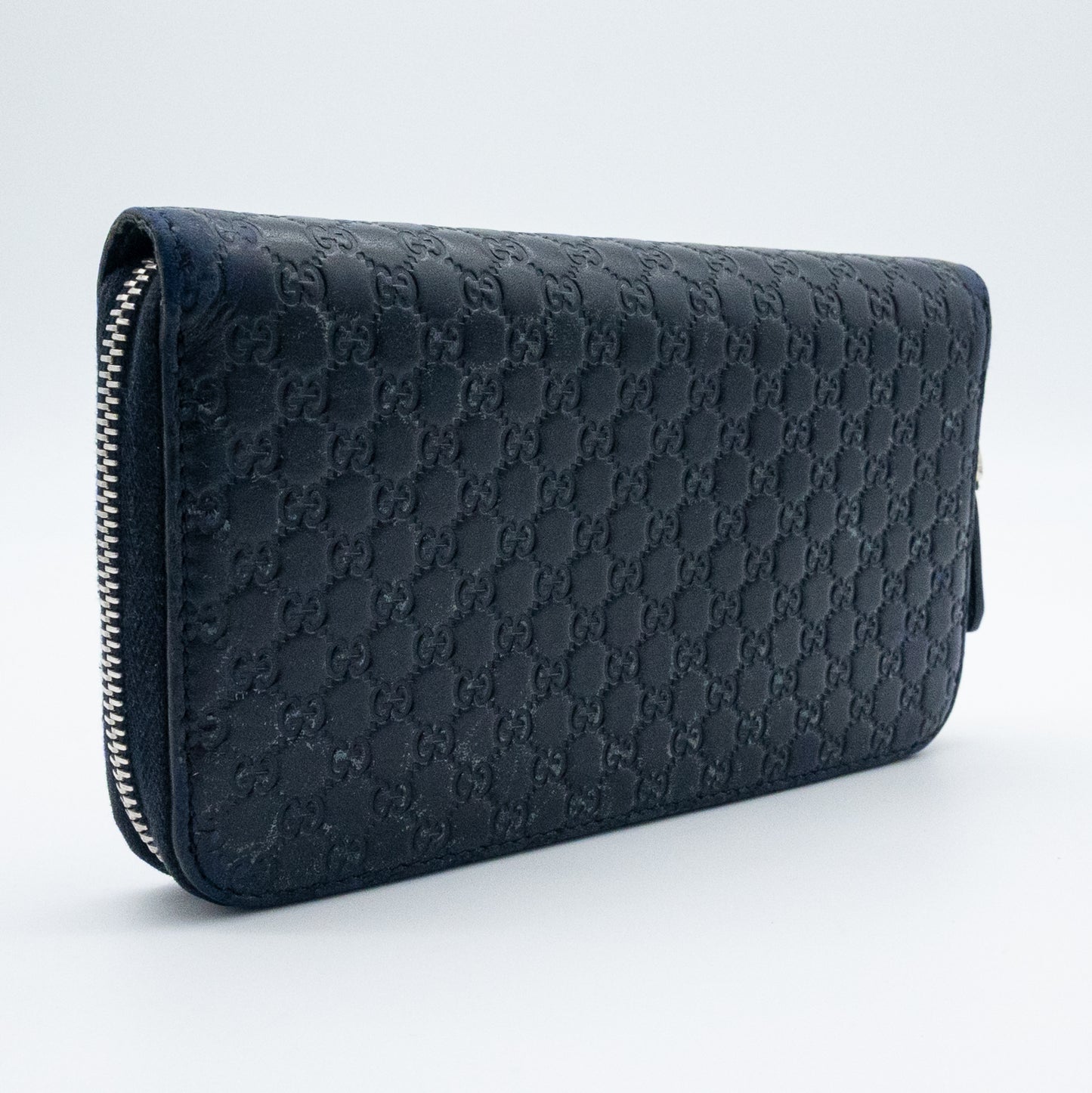 Gucci GG Embossed Navy Blue Zip-Around Wallet