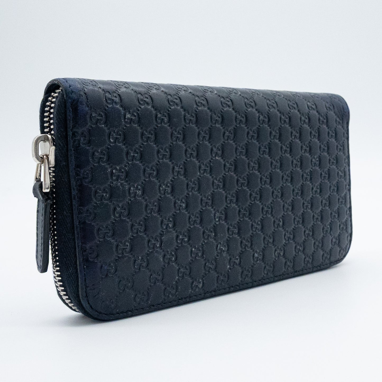 Gucci GG Embossed Navy Blue Zip-Around Wallet