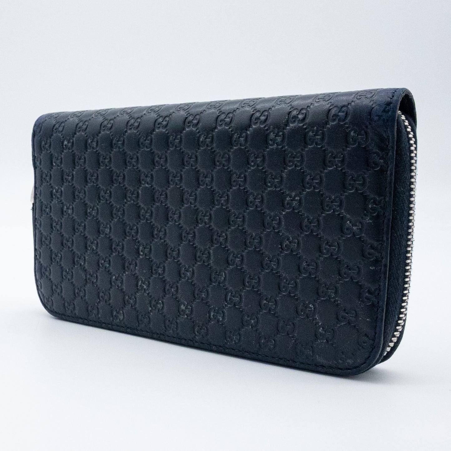 Gucci GG Embossed Navy Blue Zip-Around Wallet