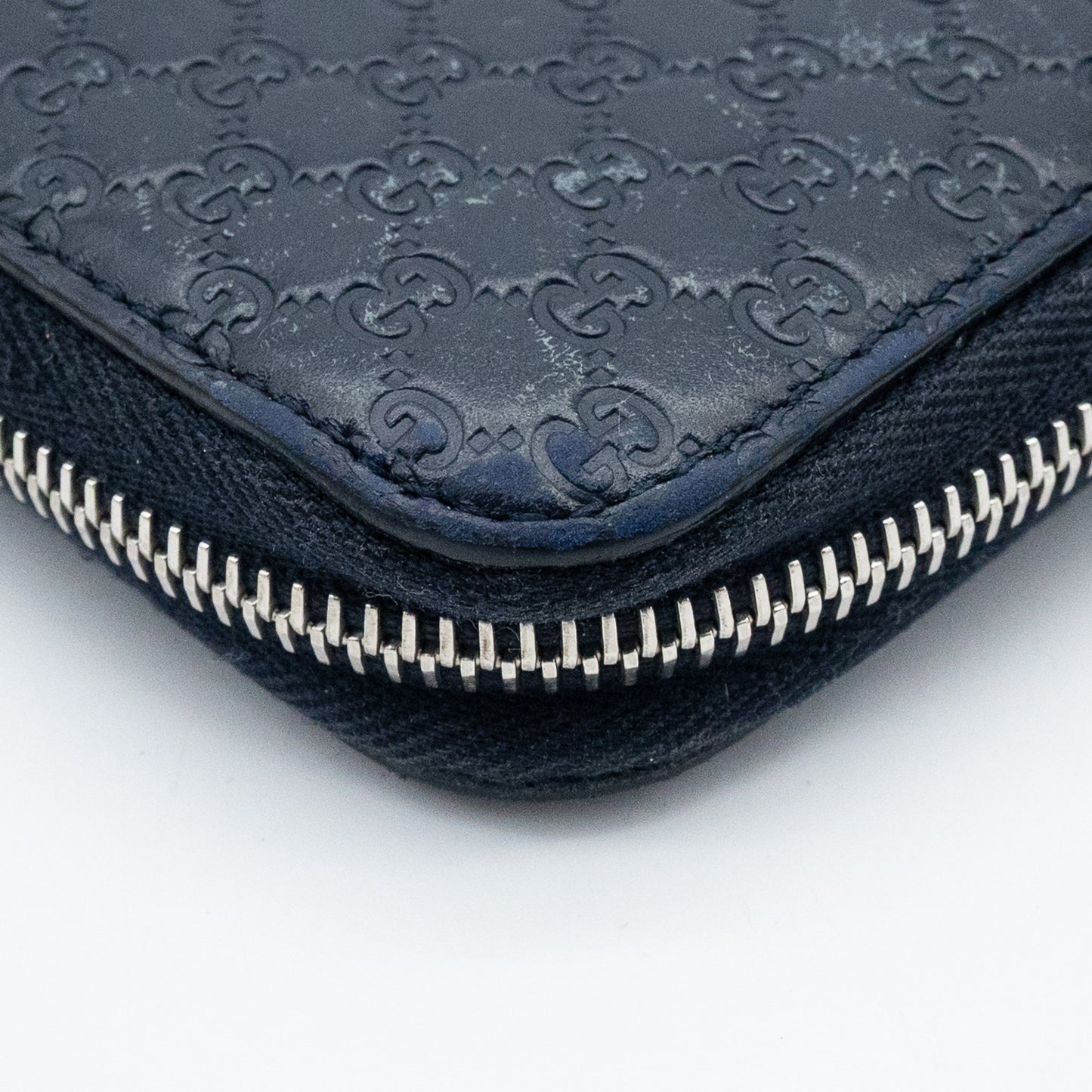 Gucci GG Embossed Navy Blue Zip-Around Wallet