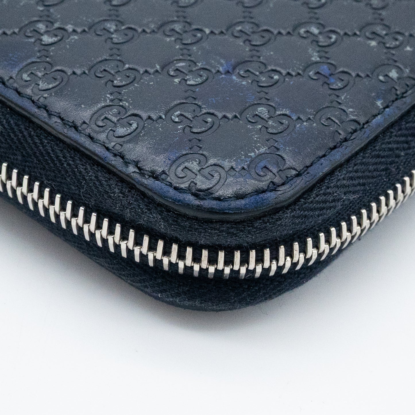 Gucci GG Embossed Navy Blue Zip-Around Wallet