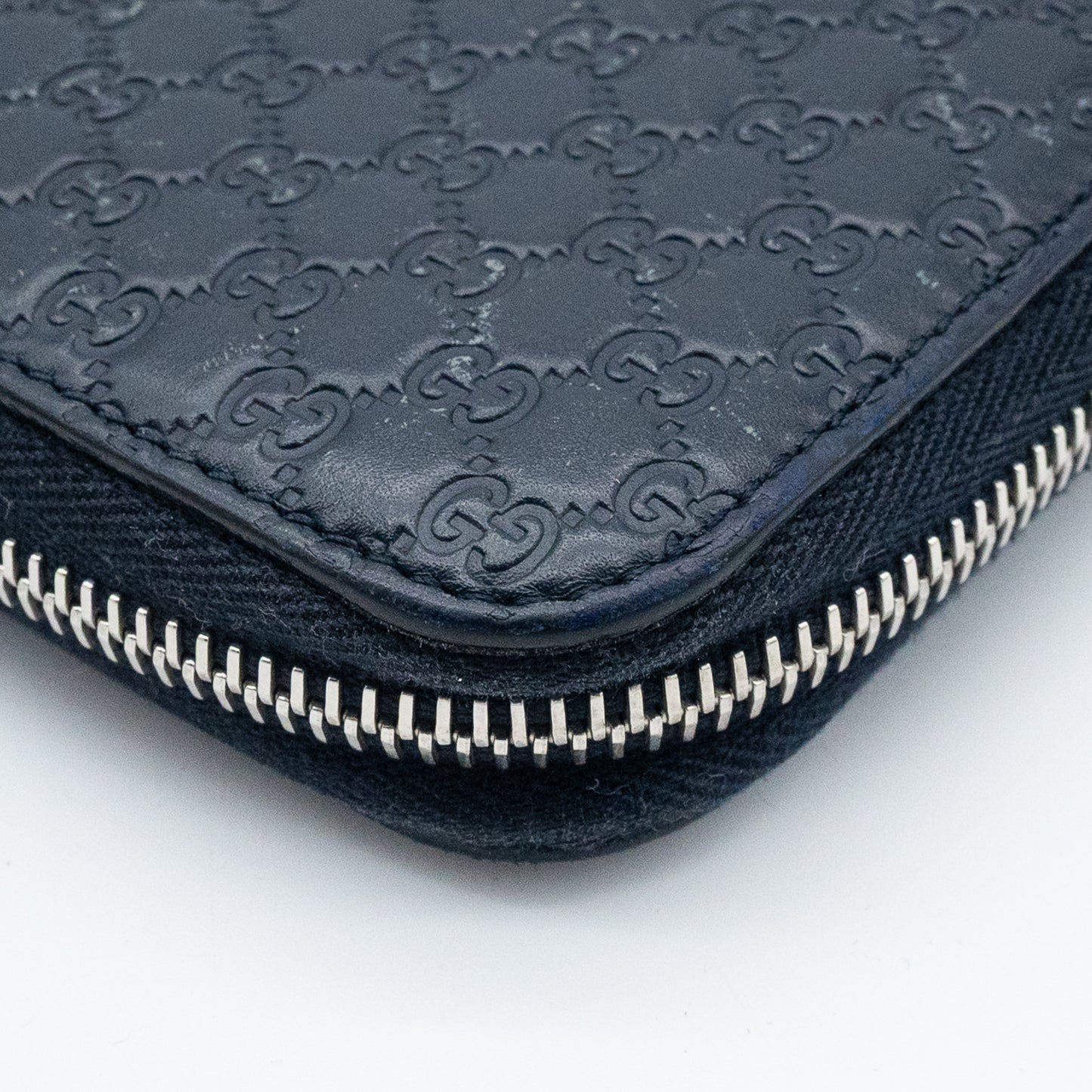 Gucci GG Embossed Navy Blue Zip-Around Wallet