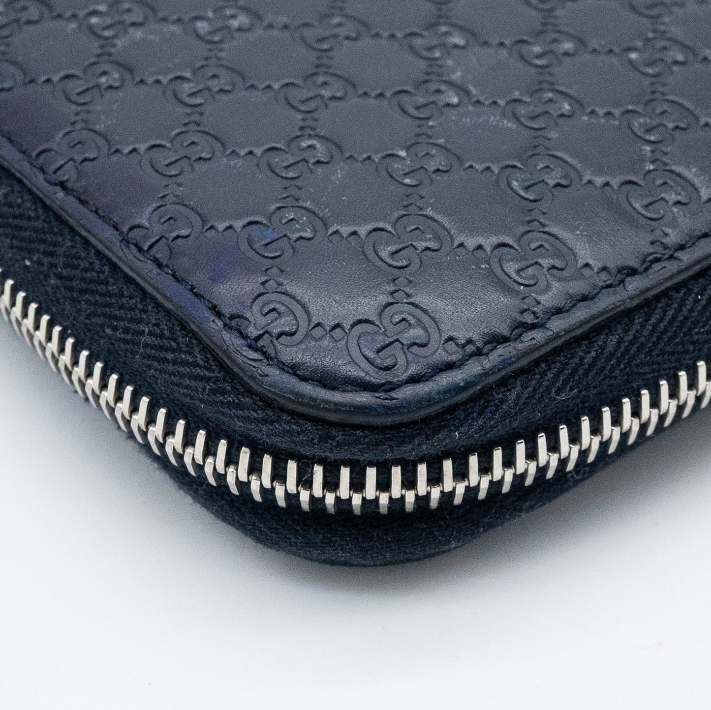 Gucci GG Embossed Navy Blue Zip-Around Wallet