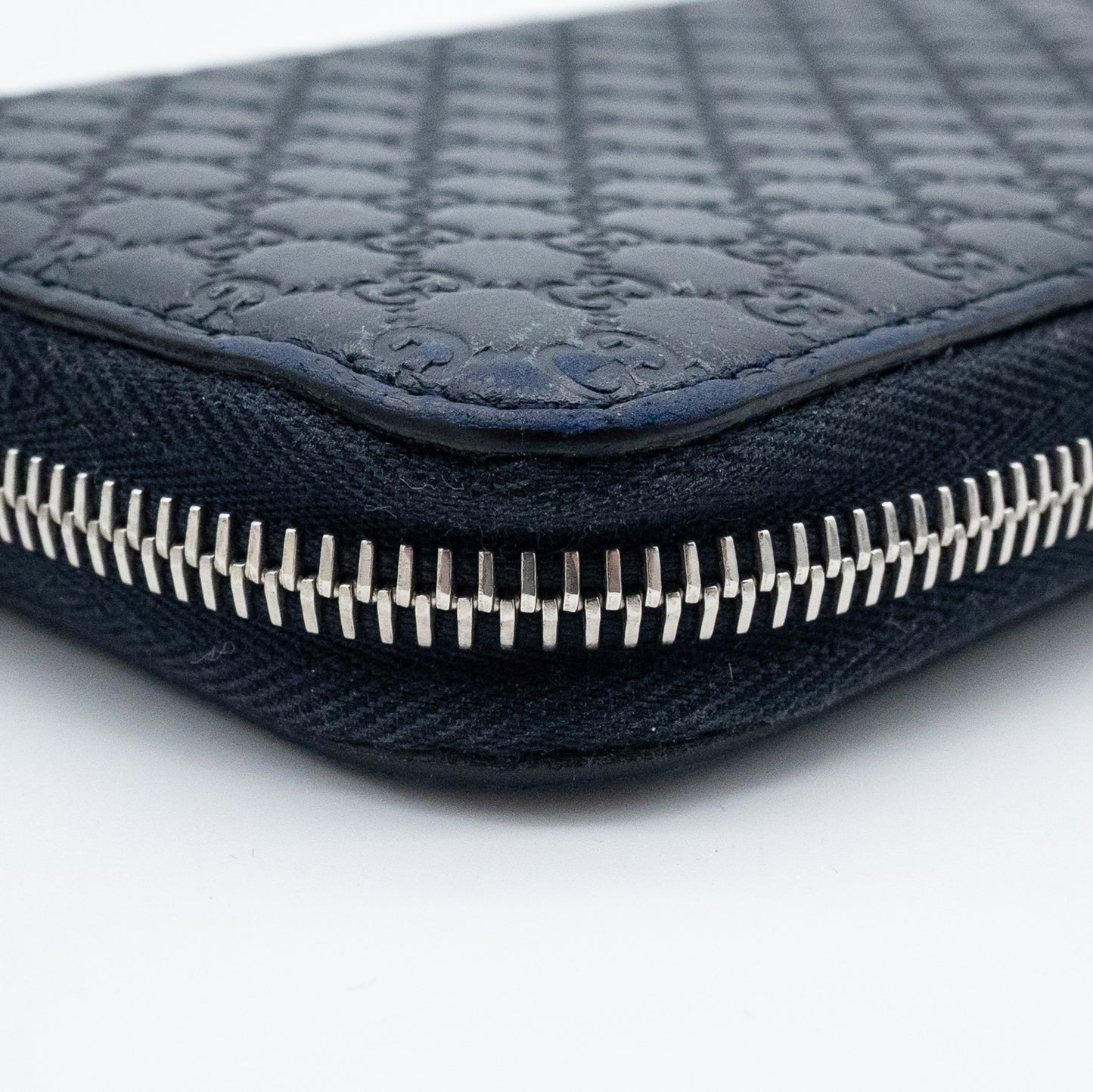 Gucci GG Embossed Navy Blue Zip-Around Wallet