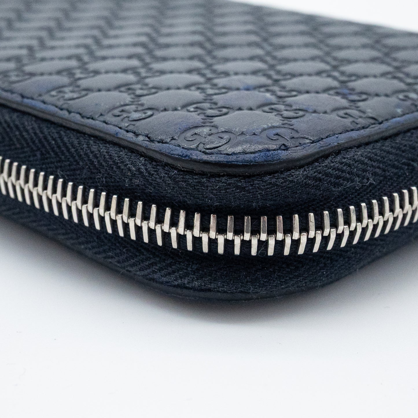 Gucci GG Embossed Navy Blue Zip-Around Wallet