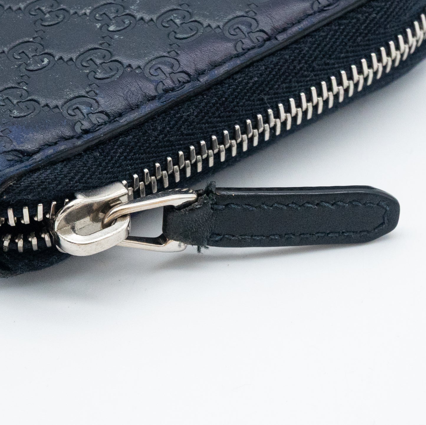 Gucci GG Embossed Navy Blue Zip-Around Wallet