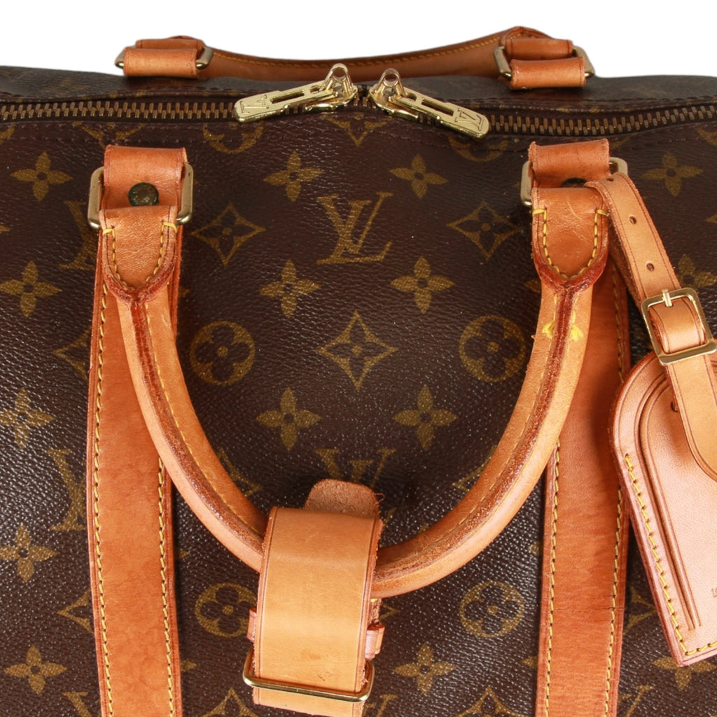 Authentic Louis Vuitton Monogram Keepall bandouliere 55 hand/travel bag