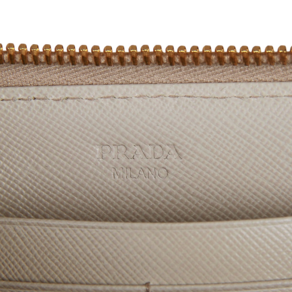 Authentic Prada Saffiano cream leather zip around wallet 1M0506