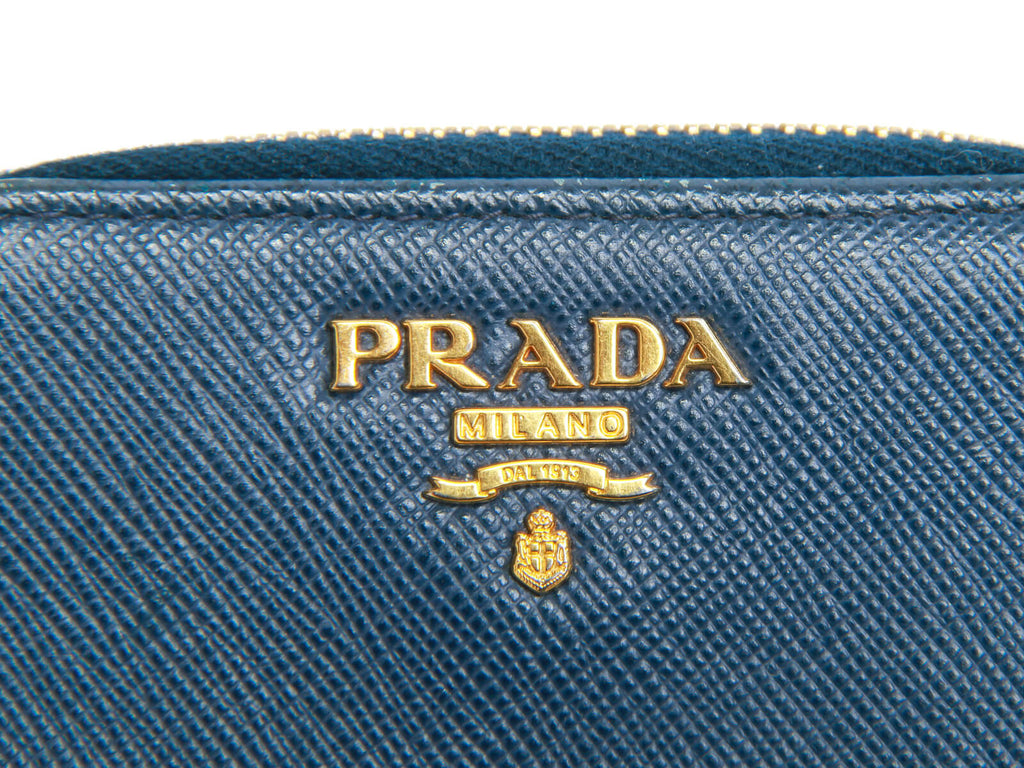 Authentic Prada Saffiano blue leather zip around coin wallet