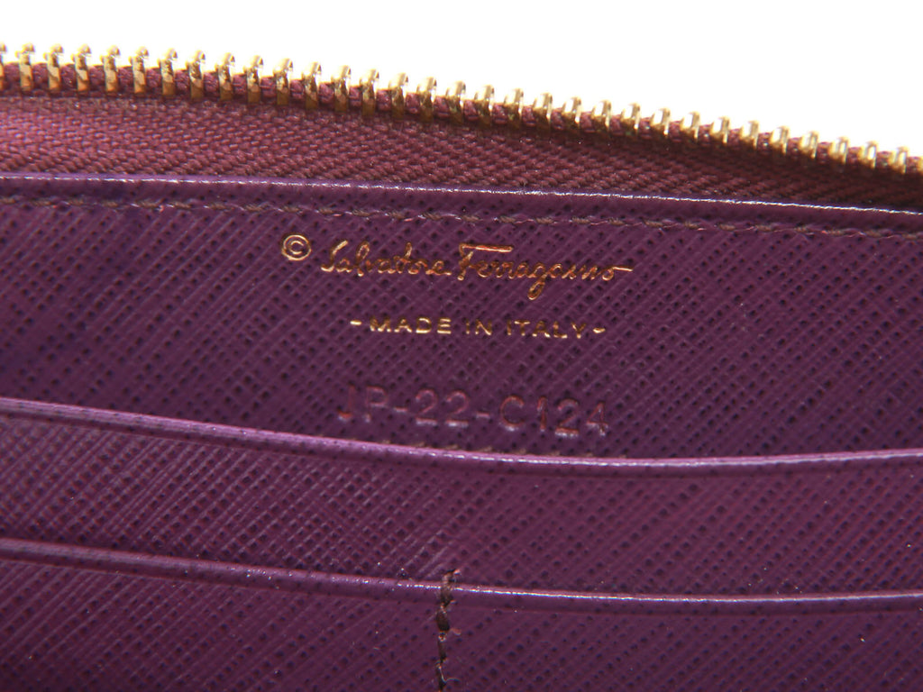 Authentic Salvatore Ferragamo purple Zip-around long wallet